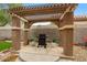 Outdoor BBQ area featuring pergola, a built-in grill, perfect for backyard entertaining at 7971 W Montebello Ave, Glendale, AZ 85303