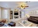 Cozy living room features a custom built-in entertainment center at 7971 W Montebello Ave, Glendale, AZ 85303