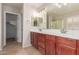 Bathroom features a double sink vanity and a large mirror at 901 S Storment Ln, Gilbert, AZ 85296