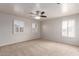 Spacious bedroom with neutral carpet and shutters on the windows at 901 S Storment Ln, Gilbert, AZ 85296