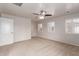 Bedroom featuring neutral carpet, ceiling fan, and plantation shutters at 901 S Storment Ln, Gilbert, AZ 85296