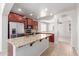 Bright kitchen featuring granite counters, stainless appliances and cherry wood cabinetry at 901 S Storment Ln, Gilbert, AZ 85296