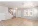 Inviting living room with tile flooring, staircase, and white doors for easy access at 901 S Storment Ln, Gilbert, AZ 85296