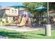 Community playground with a variety of play structures for enjoyment and activity at 901 S Storment Ln, Gilbert, AZ 85296