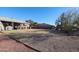 Expansive backyard with gravel and grass areas, providing ample space for outdoor activities at 9735 W Ironwood Dr # A, Peoria, AZ 85345