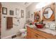 Unique bathroom featuring a glass vessel sink, wooden accents, and stylish decor at 9735 W Ironwood Dr # A, Peoria, AZ 85345