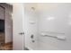 Bathroom with shower and tub combo, plus a view into the next room at 10064 E Kilarea Ave, Mesa, AZ 85209