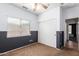 Bedroom with a ceiling fan, and double door closet offering storage space at 10064 E Kilarea Ave, Mesa, AZ 85209