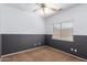 This bedroom features neutral paint, a ceiling fan, and a window for plenty of natural light at 10064 E Kilarea Ave, Mesa, AZ 85209