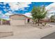 Charming single-story home with a well-maintained yard and two car garage at 10064 E Kilarea Ave, Mesa, AZ 85209