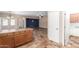 Open-concept kitchen flows into living area with tile floors and access to a side entryway at 10064 E Kilarea Ave, Mesa, AZ 85209