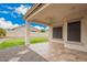 Back patio and landscaped yard with a ceiling fan and speakers at 10064 E Kilarea Ave, Mesa, AZ 85209