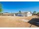 Expansive backyard featuring a concrete patio and potential for landscaping, perfect for outdoor entertaining at 1012 E Estevan Ave, Apache Junction, AZ 85119