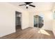This open bedroom offers lots of natural light and a large sliding glass door to the back yard at 1012 E Estevan Ave, Apache Junction, AZ 85119