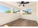 Bright bedroom featuring hardwood floors, white trim, and ample natural light at 1012 E Estevan Ave, Apache Junction, AZ 85119