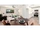 Bright open concept living space featuring modern kitchen and dining areas, perfect for entertaining at 1012 E Estevan Ave, Apache Junction, AZ 85119