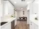 Bright updated kitchen leading to modern dining area, with sleek appliances and fixtures at 1012 E Estevan Ave, Apache Junction, AZ 85119