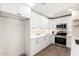 Well-lit modern kitchen featuring white cabinets, stainless steel appliances, and sleek countertops at 1012 E Estevan Ave, Apache Junction, AZ 85119