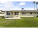 A well-maintained backyard with a covered patio offers a private outdoor living space at 10927 W Peoria Ave, Sun City, AZ 85351