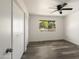 Bright bedroom with a ceiling fan, natural light and neutral wall colors at 10927 W Peoria Ave, Sun City, AZ 85351