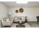 Inviting living room showcasing modern decor, with a neutral color palette and ample natural light at 10927 W Peoria Ave, Sun City, AZ 85351