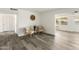 Bright living room showcasing hardwood flooring and comfortable seating at 10927 W Peoria Ave, Sun City, AZ 85351