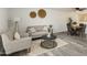 Cozy living room with stylish furniture, modern decor, and a hardwood floor at 10927 W Peoria Ave, Sun City, AZ 85351