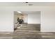 Open-concept living space with hardwood floors, seamlessly connecting the living and dining areas at 10927 W Peoria Ave, Sun City, AZ 85351
