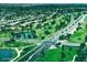 Scenic aerial view of community with lush landscaping, golf course, and convenient road access at 1211 N Miller Rd # 213, Scottsdale, AZ 85257