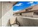 Cozy balcony with chair offering outdoor space with views of the community's architecture at 1211 N Miller Rd # 213, Scottsdale, AZ 85257