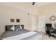 Bright bedroom featuring neutral tones, ceiling fan, plush carpet, and dual closets at 1211 N Miller Rd # 213, Scottsdale, AZ 85257