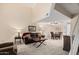 Bright living room with open floor plan, comfortable seating, and neutral carpet at 1211 N Miller Rd # 213, Scottsdale, AZ 85257