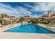 Stunning community pool with lounge chairs and shade umbrellas at 1211 N Miller Rd # 213, Scottsdale, AZ 85257