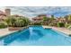 Inviting community pool surrounded by lush landscaping and comfortable seating at 1211 N Miller Rd # 213, Scottsdale, AZ 85257