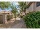 Charming community walkway lined with trees and beautiful landscaping at 1211 N Miller Rd # 213, Scottsdale, AZ 85257