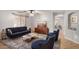 Inviting living room with a plush rug, comfortable seating, and stylish decor at 12427 W El Nido Ln, Litchfield Park, AZ 85340