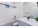 Bright bathroom featuring black hardware, a shower/tub combo, and white finishes at 14407 N 75Th Dr, Peoria, AZ 85381