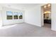 Spacious bedroom with large windows and adjoining bathroom at 14407 N 75Th Dr, Peoria, AZ 85381
