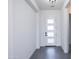 Modern entryway with clean lines, white walls, and a stylish front door at 14407 N 75Th Dr, Peoria, AZ 85381