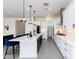 Bright, open kitchen showcases a large island with pendant lighting and modern appliances at 14407 N 75Th Dr, Peoria, AZ 85381