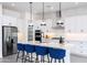 Well-equipped kitchen featuring an island with seating, stainless appliances, and pendant lights at 14407 N 75Th Dr, Peoria, AZ 85381