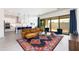 Open-concept living area with stylish furniture and sliding glass doors at 14407 N 75Th Dr, Peoria, AZ 85381