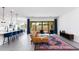 Open-concept living room with kitchen view and modern, stylish furnishings at 14407 N 75Th Dr, Peoria, AZ 85381