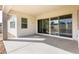 Covered patio featuring a concrete floor and sliding glass doors for seamless indoor-outdoor living at 14407 N 75Th Dr, Peoria, AZ 85381