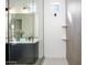 Modern bathroom features glass enclosed shower with white tile and gray accent tiles at 14407 N 75Th Dr, Peoria, AZ 85381