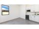 Additional kitchenette boasts built-in wet bar area, ample storage, and tons of natural light at 14407 N 75Th Dr, Peoria, AZ 85381