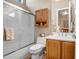 Bathroom featuring a walk-in shower, bath tub, tile flooring, and a single sink vanity at 1557 W Laurel Greens Ct, Anthem, AZ 85086