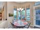 Cozy breakfast nook featuring large picture windows, views of the back yard and a stylish light fixture at 1557 W Laurel Greens Ct, Anthem, AZ 85086