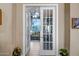 Entryway featuring glass doors leading into an additional living area at 1557 W Laurel Greens Ct, Anthem, AZ 85086