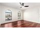 Bright bedroom with hardwood floors and arched windows at 17012 N 57Th St, Scottsdale, AZ 85254
